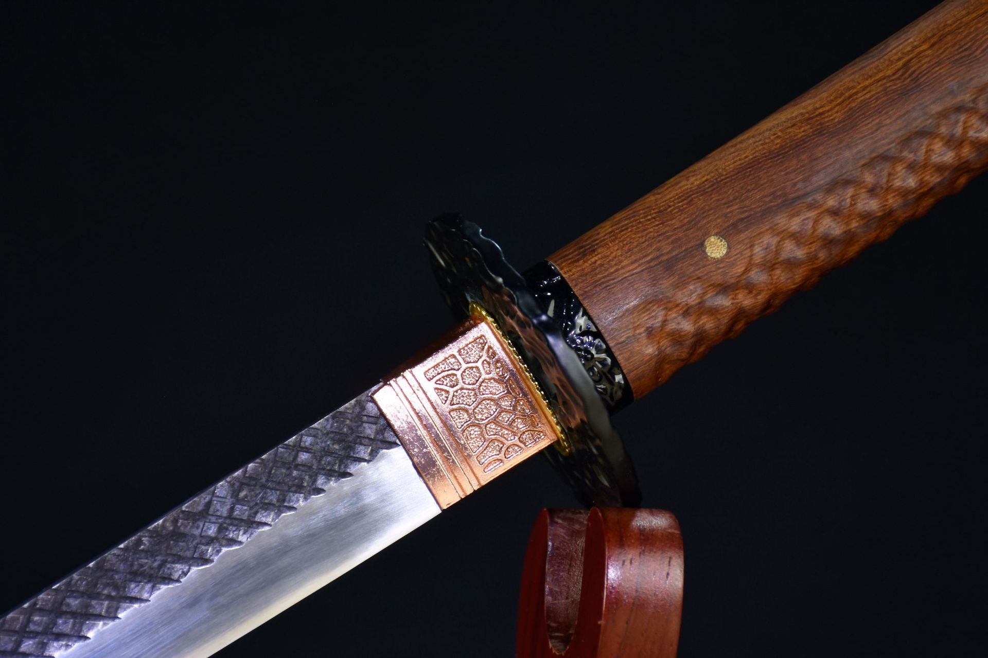 A real katana featuring a wooden handle and blade