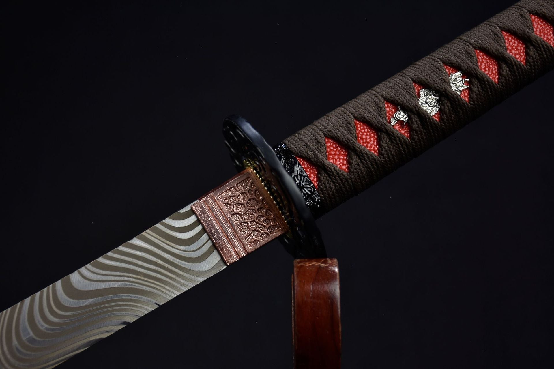 A samurai sword with a red handle
