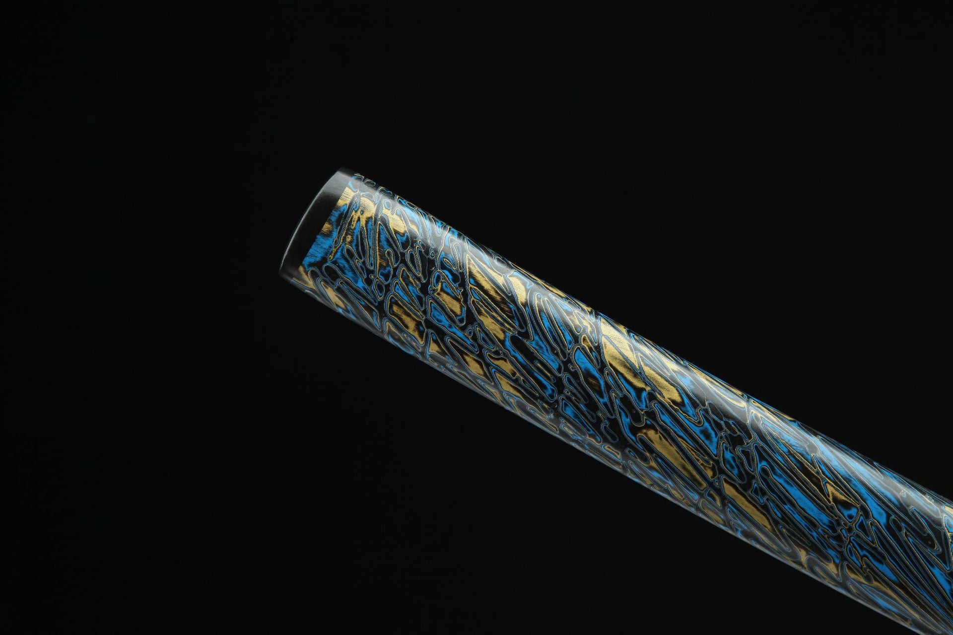 Close-up of Seiryu Samurai sword saya with decorative pattern.