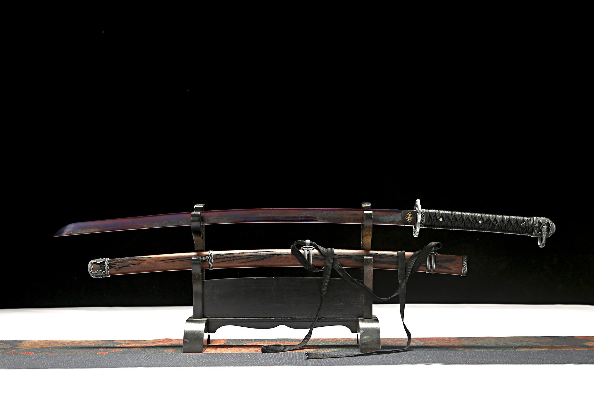  Full view of Sekiro Mortal Blade Samurai Sword with dark-toned wooden scabbard, intricate black cord wrapping on the handle, and a hand-forged steel blade.