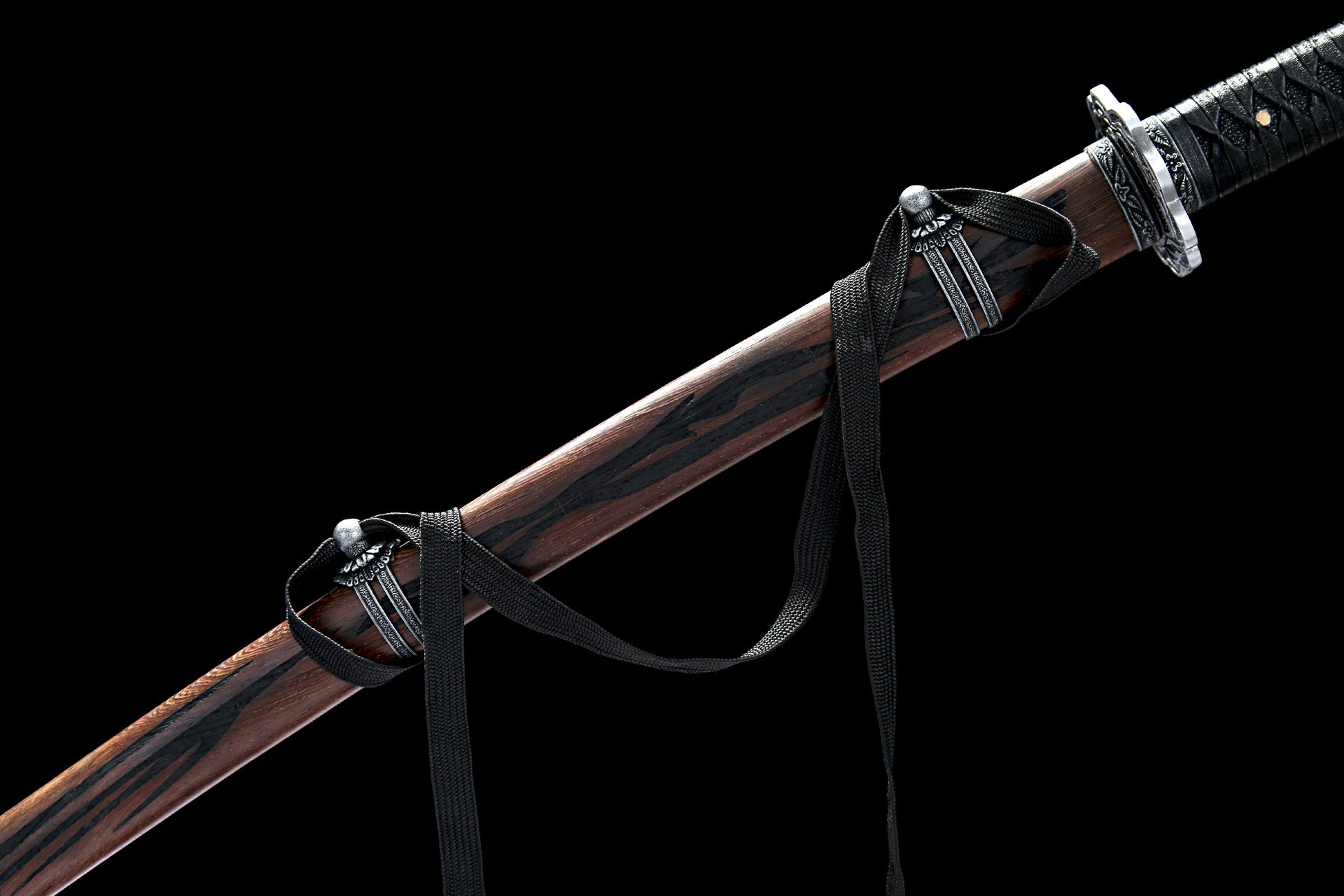Close-up of Sekiro Mortal Blade scabbard with detailed wooden texture and decorative black cords.