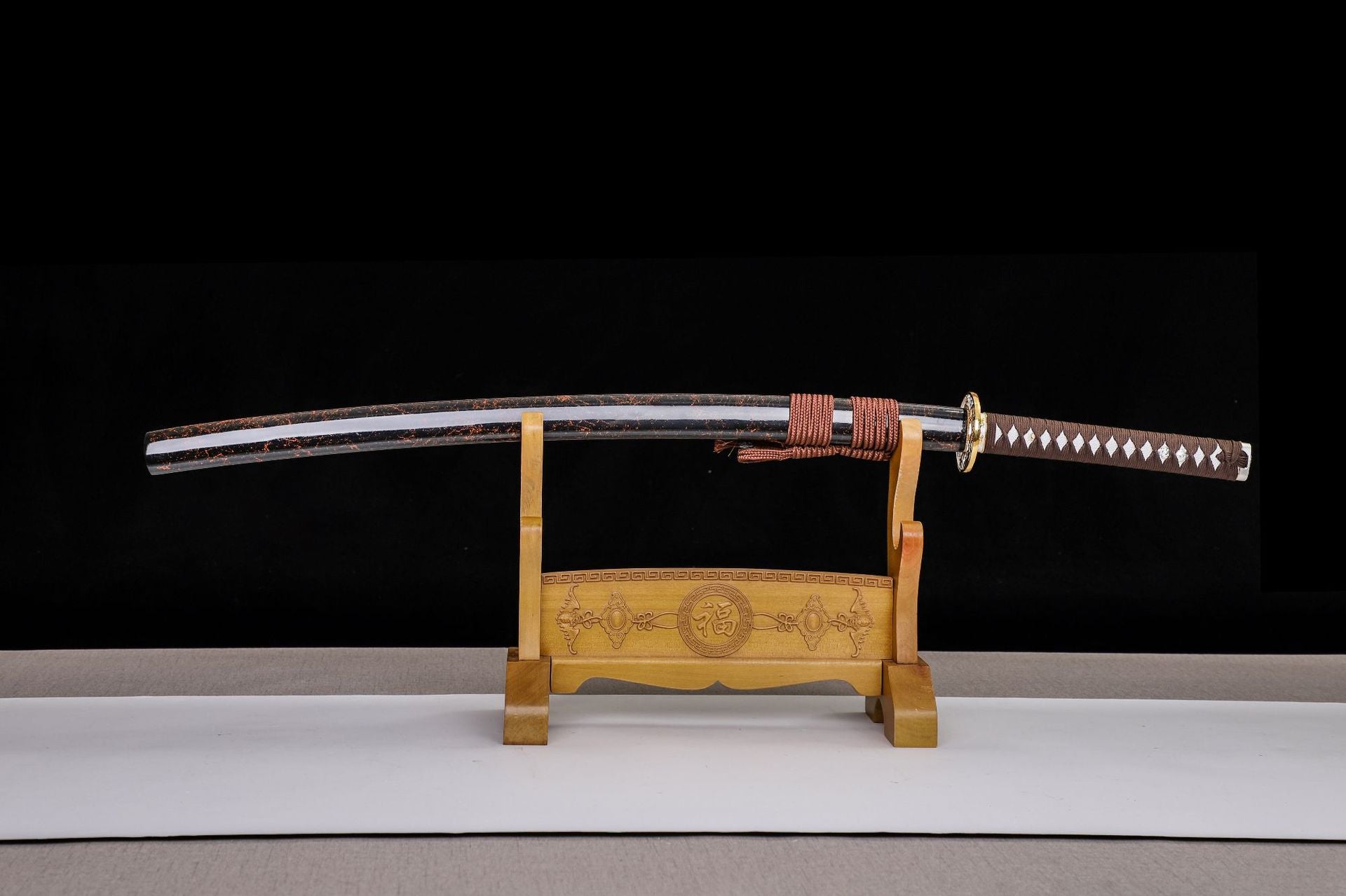 The true T10 katana, available for purchase in the US, featuring a meticulously crafted blade and traditional design.