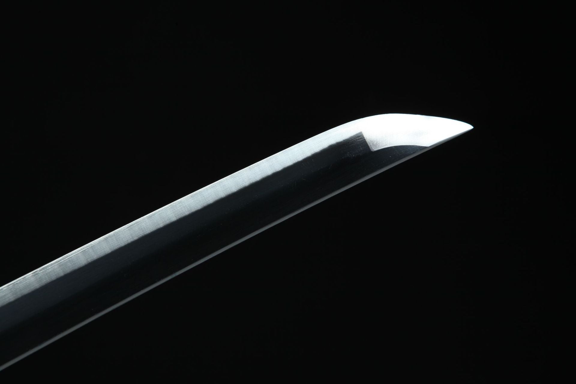 Detailed view of the tip of Wado Ichimonji sword, highlighting craftsmanship.