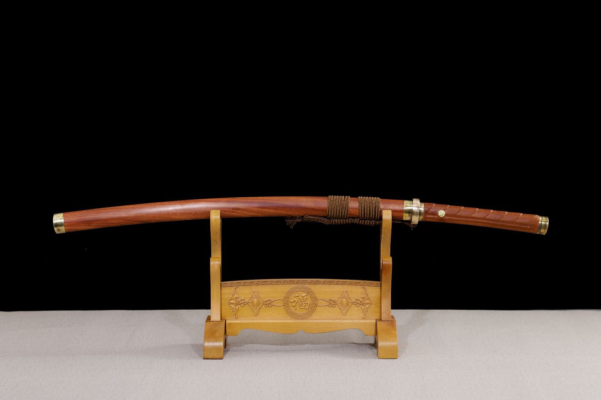 Samurai sword with wooden display stand.