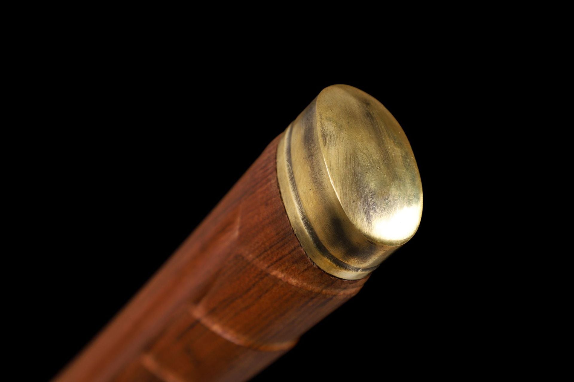 Close-up of the kashira (pommel) on the samurai sword handle.