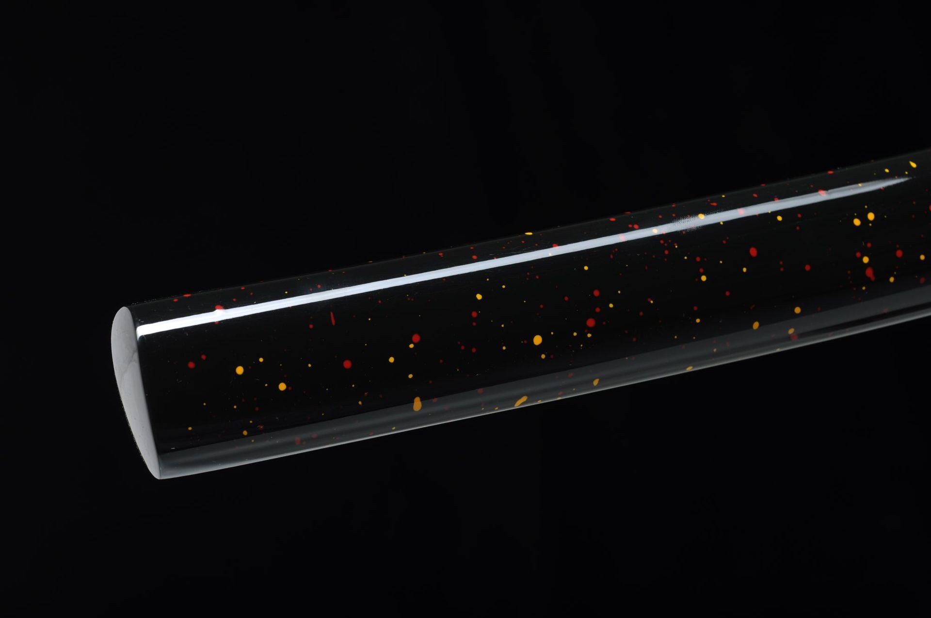 Smooth black lacquered saya of the Yuuzumi katana, speckled with colorful accents.