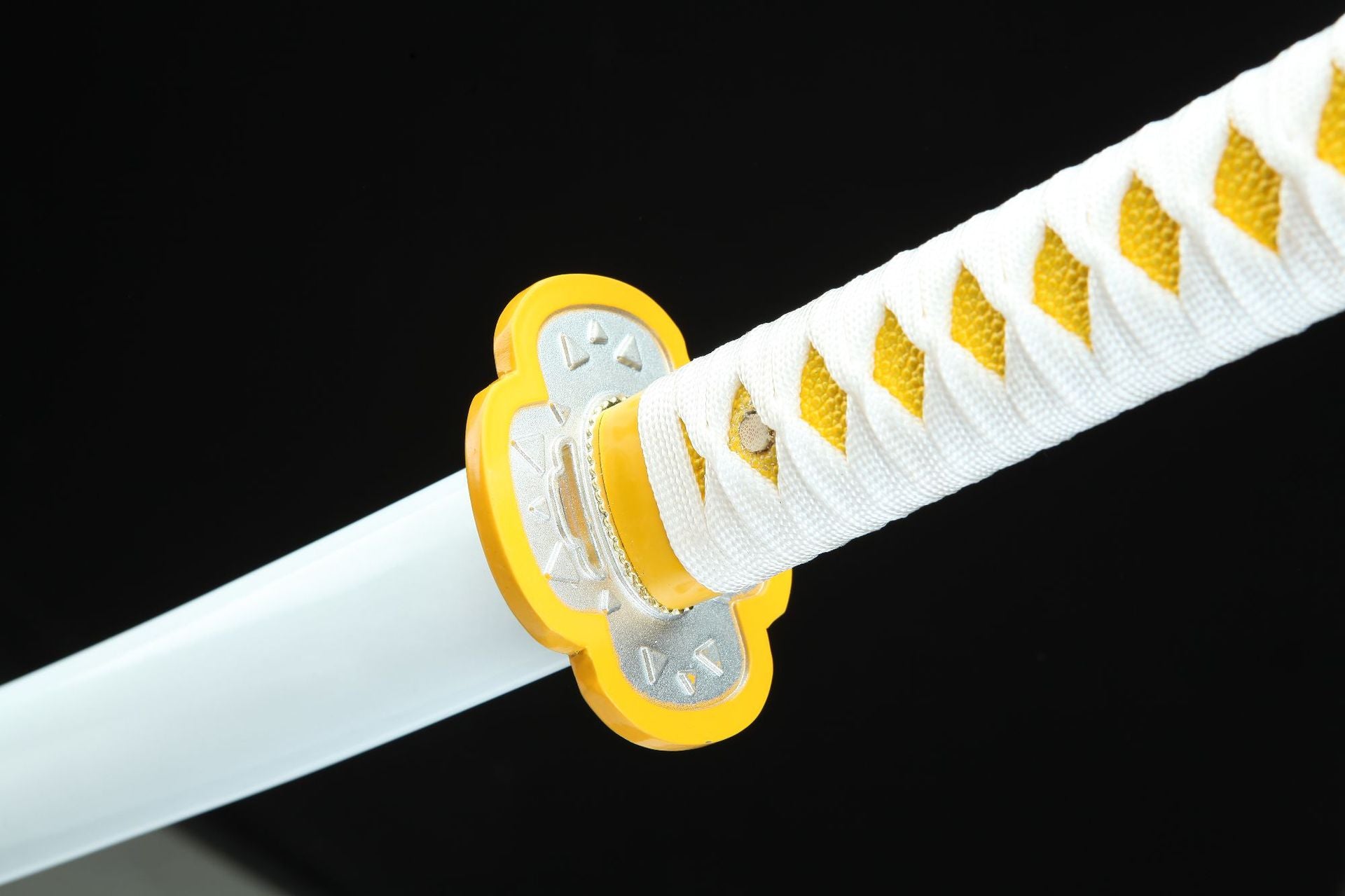 Close-up of Zenitsu's sword handle and tsuba, showcasing intricate details and design.