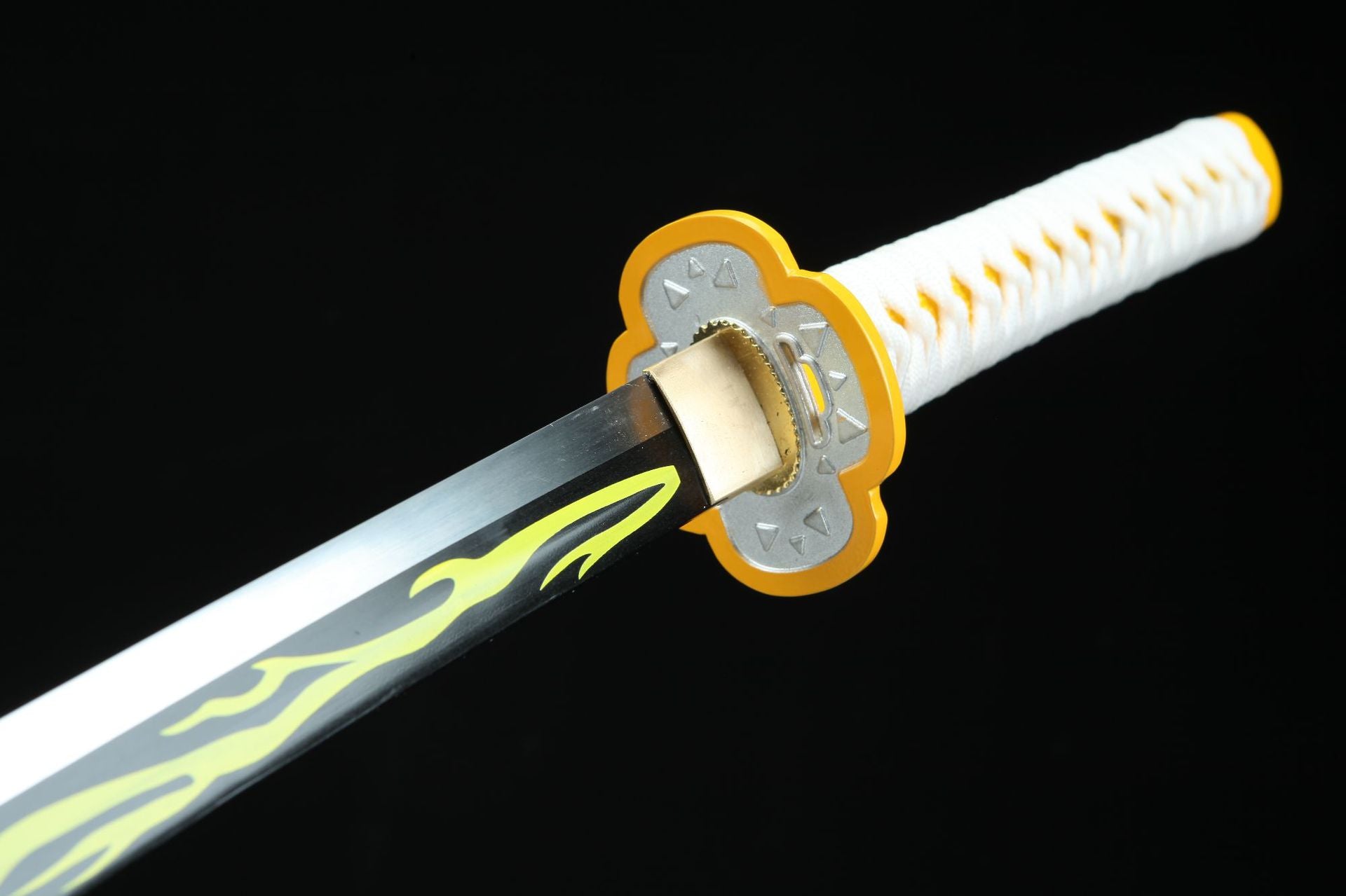 Close-up of Zenitsu’s sword tsuba, featuring a round silver center with a yellow border.
