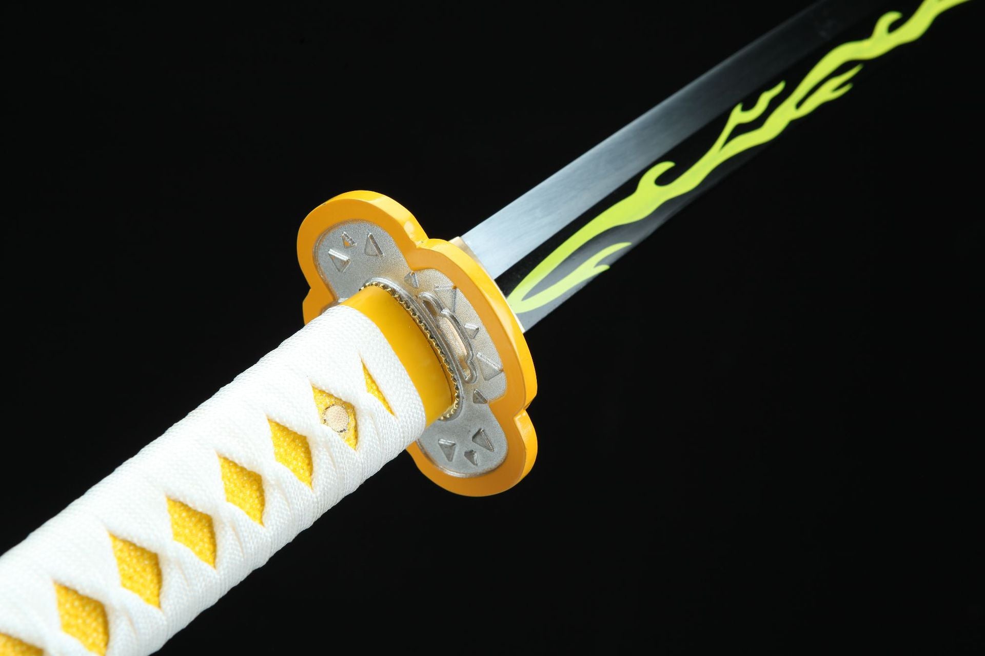 Zenitsu’s round sword tsuba featuring four indentations and small triangular relief decorations.