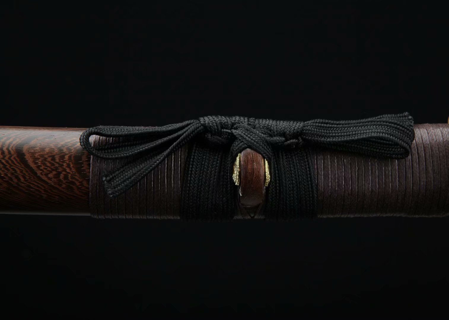 The Dragonfly Wakizashi displayed on a wooden stand, a perfect blend of traditional Japanese art and functionality.