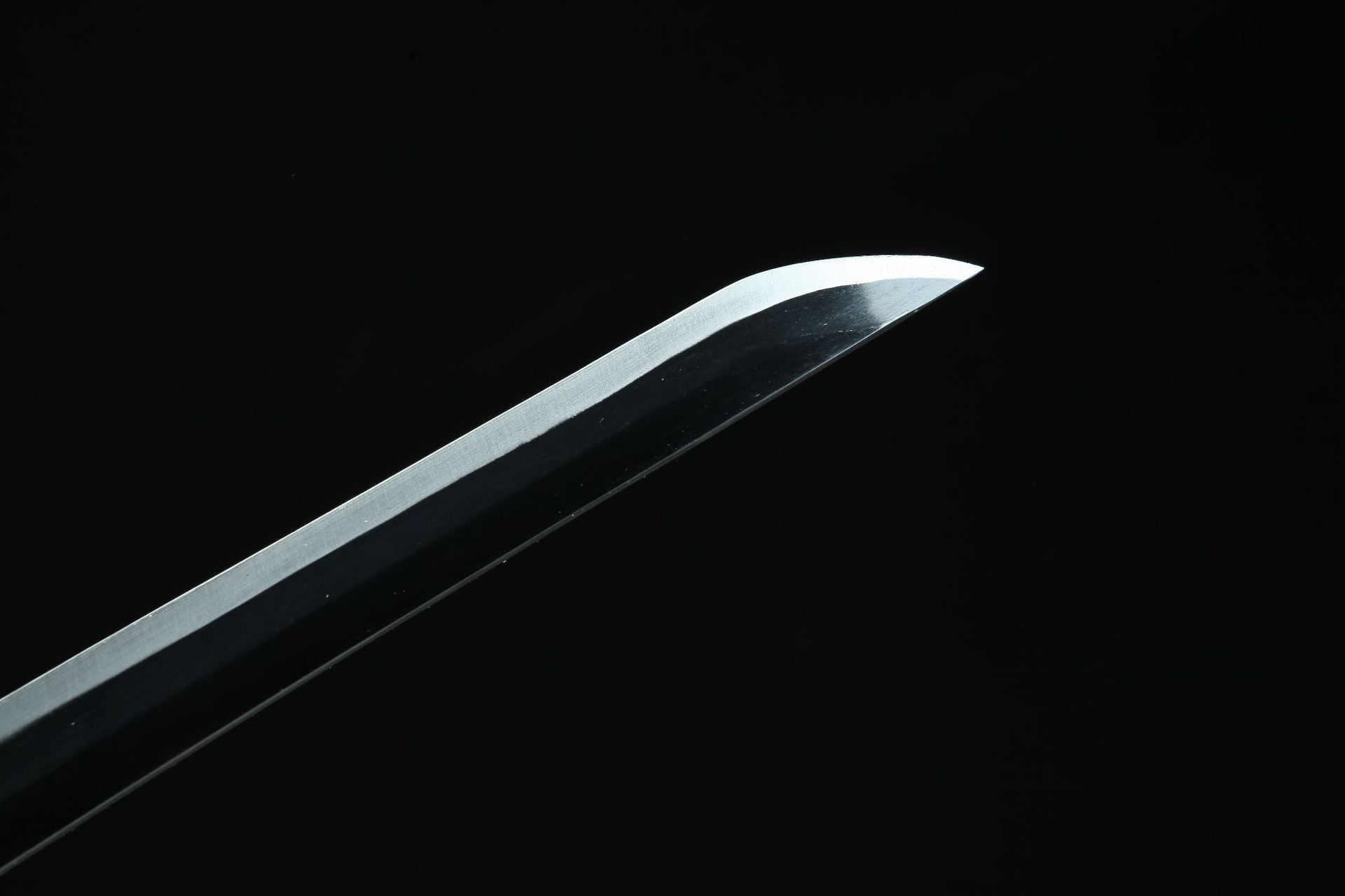 A close-up of Muichiro Sword's blade against a black background