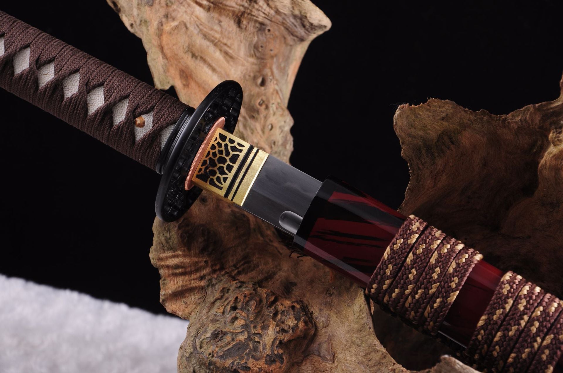 Kashin katana showcases detailed sword mountings including the tsuba handguard and its adjacent components.