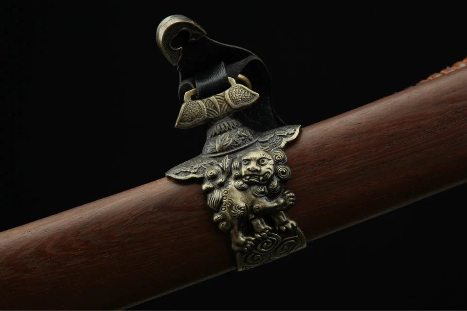 Close-up of a komainu-themed kurigata on a katana scabbard, showcasing intricate Japanese design and exceptional craftsmanship.