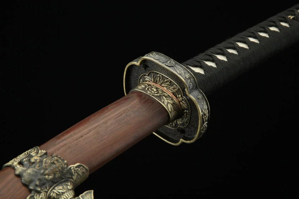 A katana featuring a komainu-themed scabbard and a chrysanthemum-designed tsuba, representing traditional Japanese artistry.