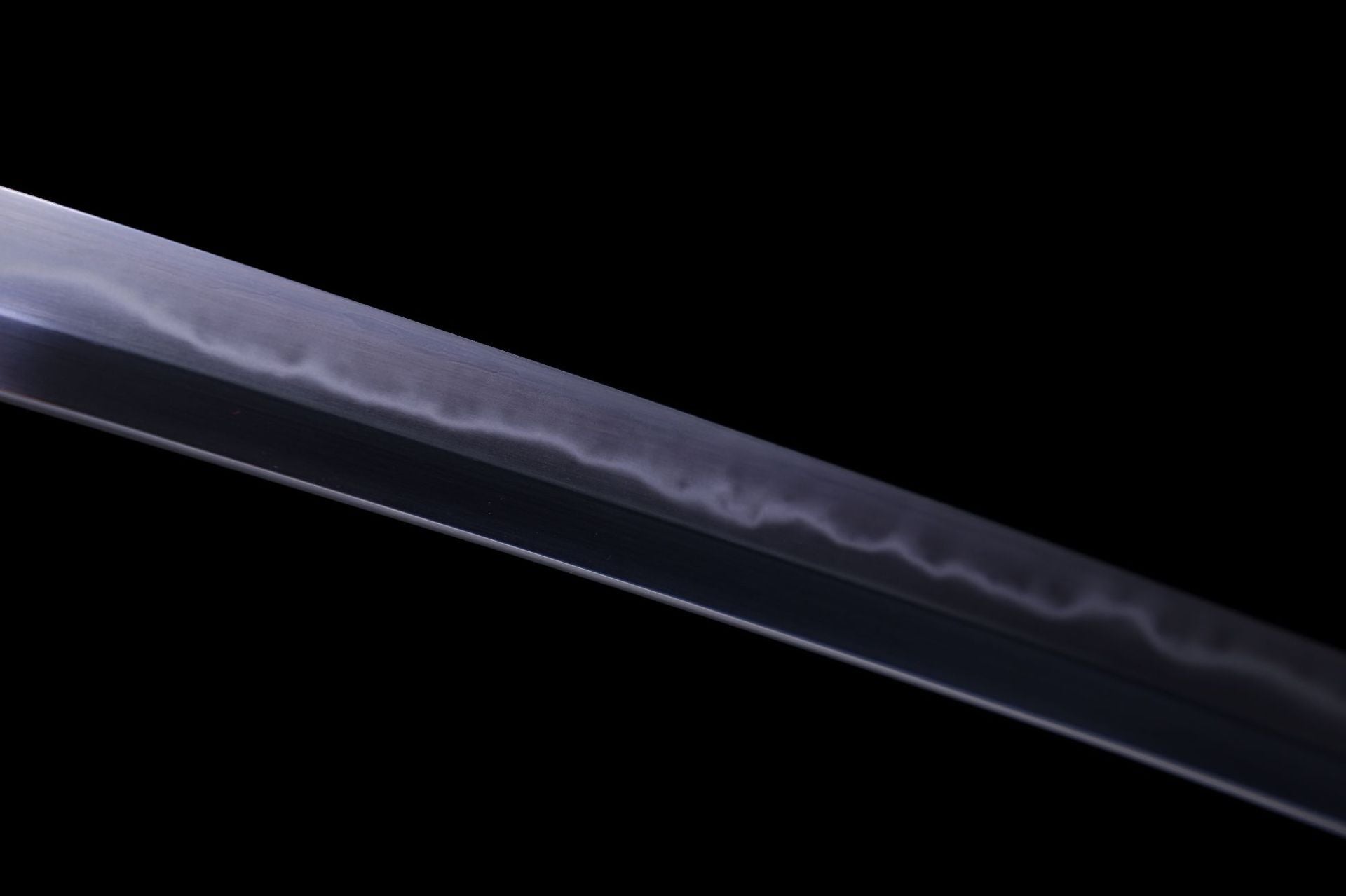 The hamon on a Kuro ShiShi katana showcasing the distinctive wave pattern along the blade.