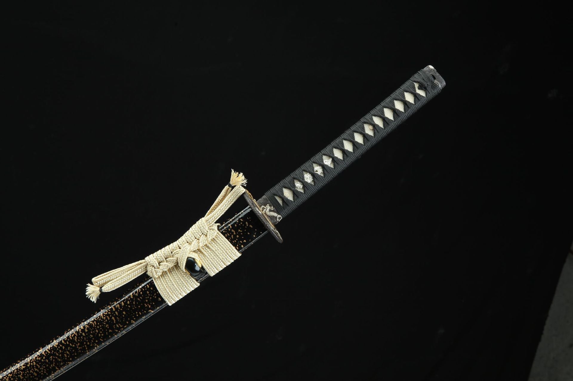Overview of the Loong Clow katana's handle and sageo, highlighting the intricate tsuka-ito wrap and the traditional sageo cord.