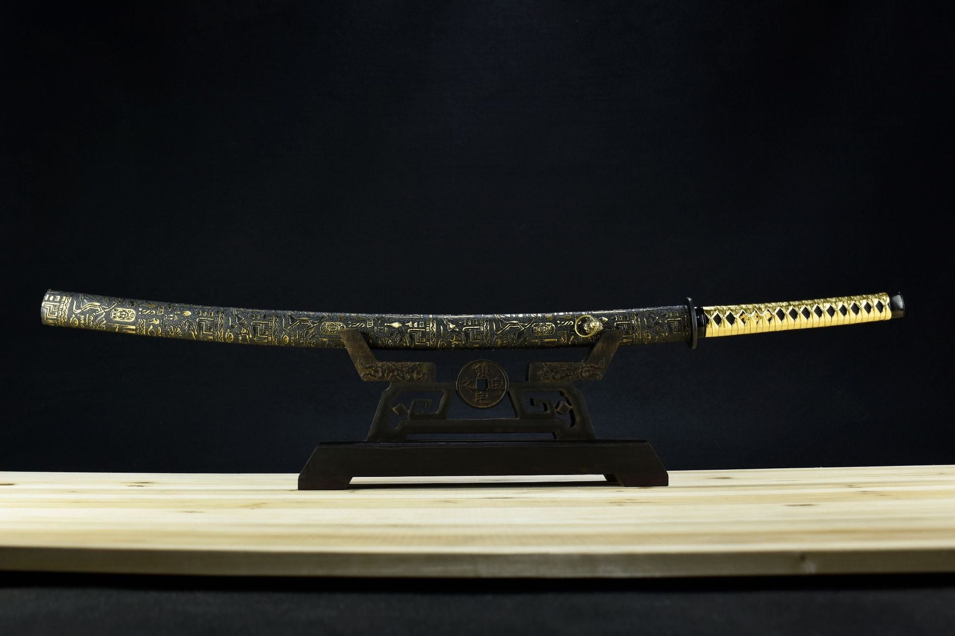 Japanese katana sword for sale, featuring a classic design and black lacquered saya.