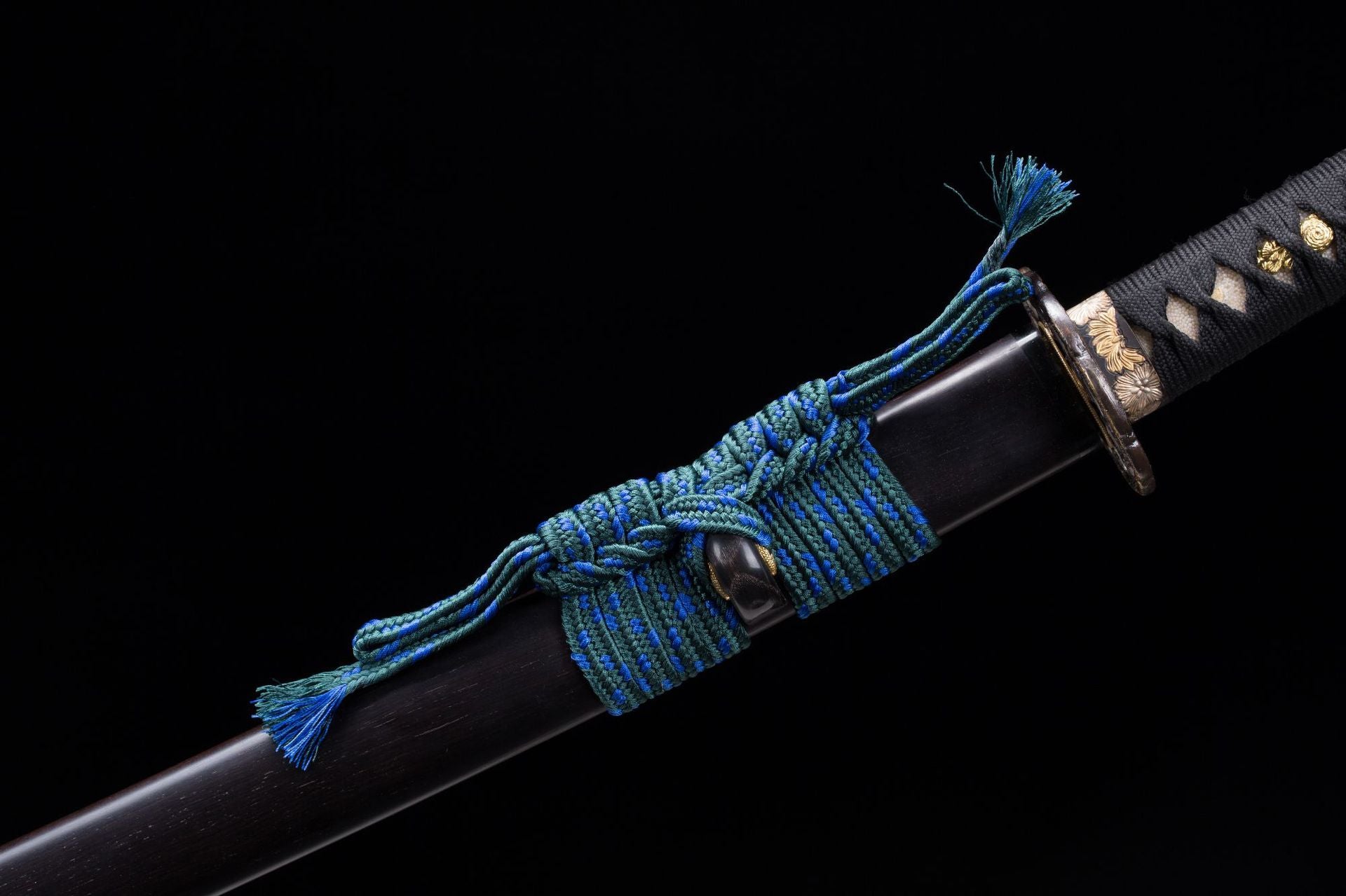 The sageo cord on a Meditation katana intricately tied to the saya showcasing detailed texture and color.