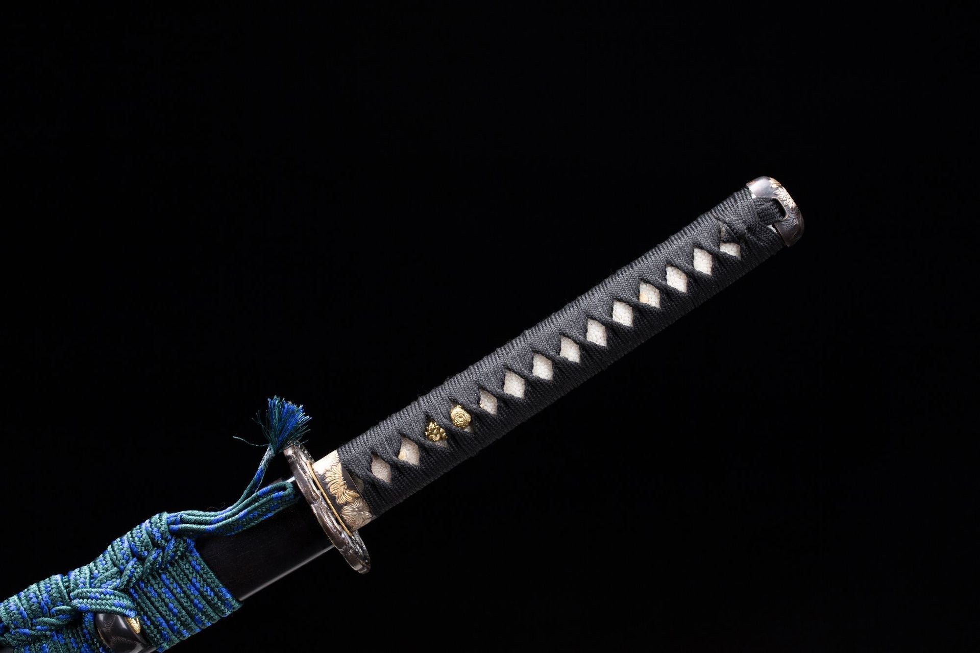 Close-up of the tsuka on a Meditation katana showing the intricate ito and menuki details.