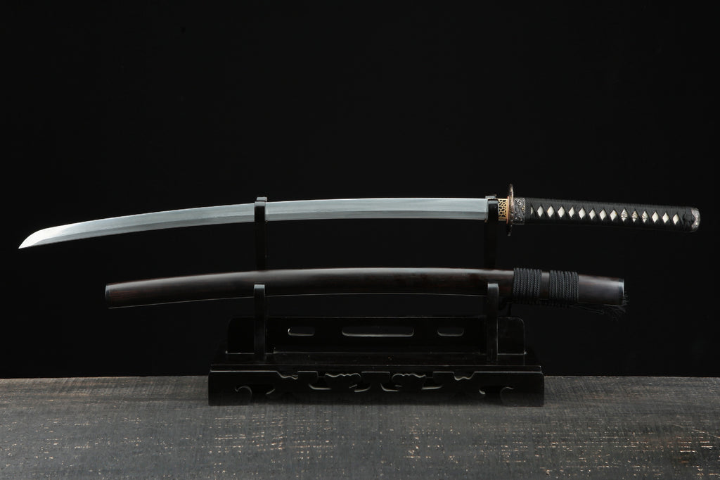 Full view of the Sunflower Ebony samurai sword displayed on a black stand with an ebony scabbard