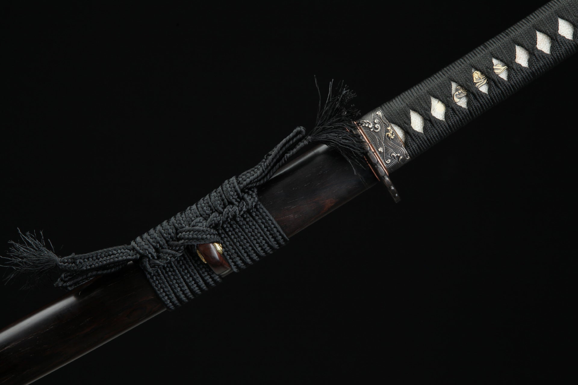Close up of the Sunflower Ebony samurai sword showing the black sageo cord and detailed fittings near the handle