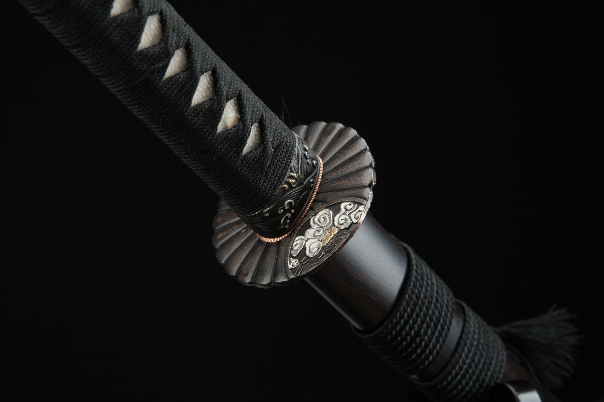 Close up of the Sunflower Bronze samurai sword tsuba showcasing intricate metal carvings