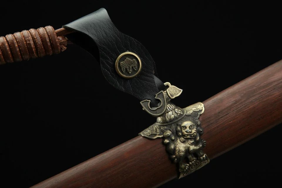 A beautifully crafted vintage kurigata on a katana scabbard, highlighting exquisite detail and traditional Japanese artistry.