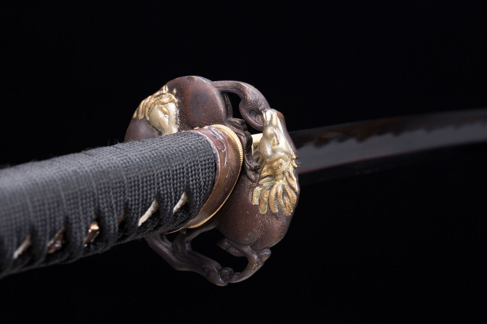 Close-up view of the reverse side of a Wild Horse samurai sword tsuba.
